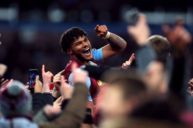 Aston Villa defender Tyrone Mings celebrates with fans on the Villa Park pitch after reaching the Carabao Cup final. Villa, who overcame Leicester 3-2 on aggregate courtesy of Trezeguet's 90th-minute winner, went on to lose 2-1 to Manchester City at Wembley