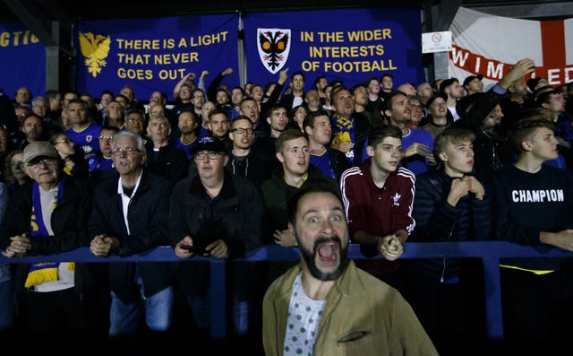AFC Wimbledon’s fans before the start of a game against MK Dons
