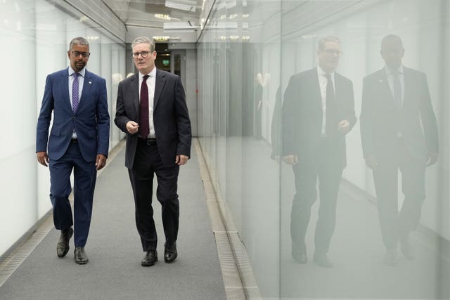 Keir Starmer with Vaughan Gething walking along a corridor