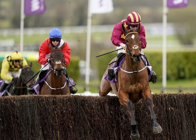 Minella Indo winning the 2021 Cheltenham Gold Cup from A Plus Tard