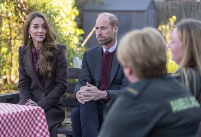 The Prince and Princess of Wales speak to members of the emergency services during a visit to Southport on October 10