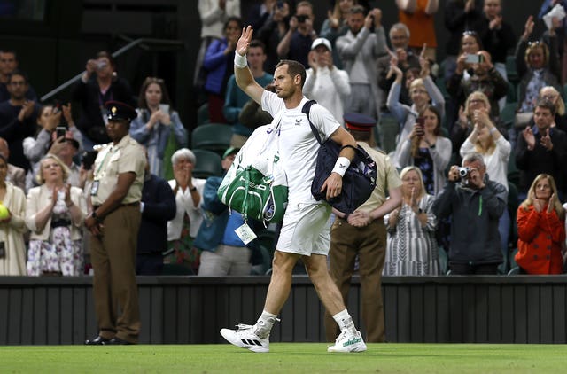 Andy Murray waves goodbye to Centre Court after a second-round exit to big-serving John Isner 