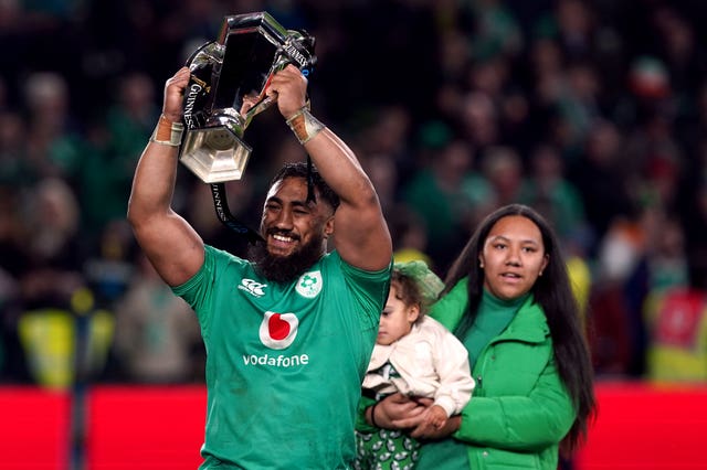 Ireland’s Bundee Aki celebrates with the Guinness Six Nations trophy
