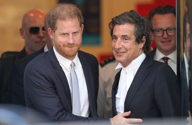 Harry with his barrister, David Sherborne, leaving the Rolls Buildings in central London after giving evidence in the phone hacking trial against Mirror Group Newspapers 