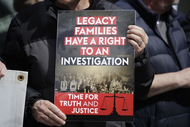 A Time for Truth and Justice campaigner holds a sign