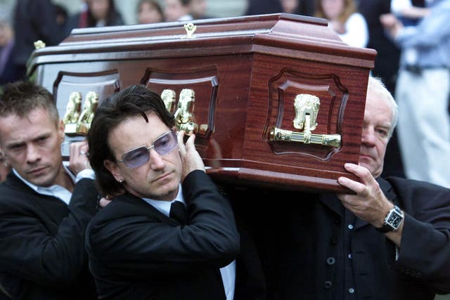 Bono helps carry his father Bob Hewson’s coffin, at his funeral at the Church of Assumption, Howth, Co Dublin 