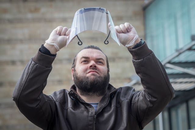 Sid Lovatt with his 3D-printed protective mask that he has been supplying to frontline workers