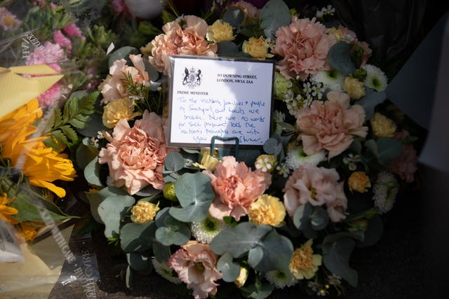 The message left by a floral tribute placed near the scene of the attack by Sir Keir Starmer