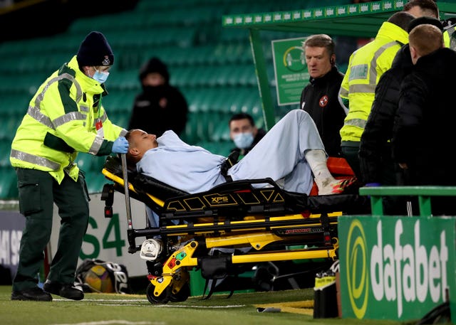 Celtic's Christopher Jullien was stretchered off after colliding with a post