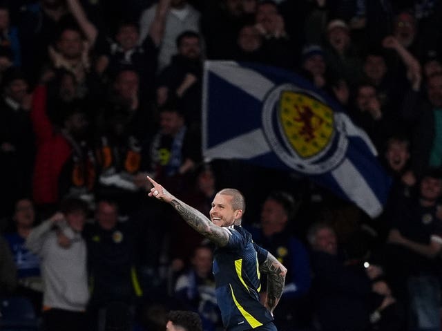 Scotland’s Lyndon Dykes celebrates scoring against Greece