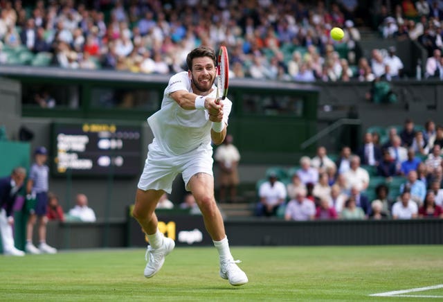Cameron Norrie lunges for a backhand