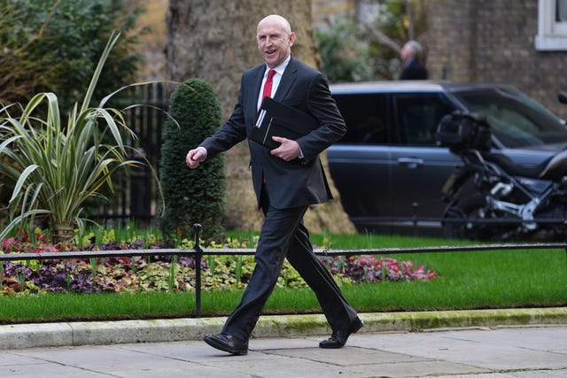 Defence Secretary John Healey walking in Downing Street