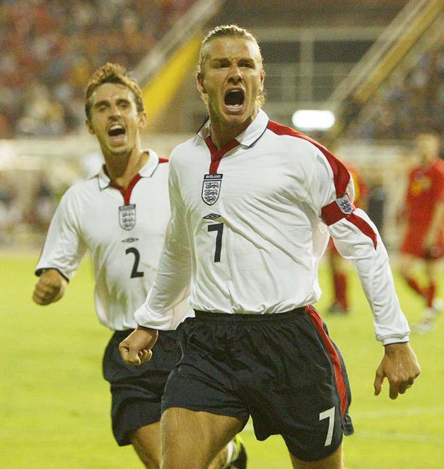 David Beckham celebrates an England goal with teammate Gary Neville