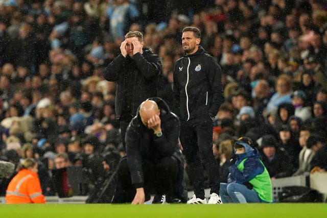 Newcastle United manager Eddie Howe (left) and Manchester City manager Pep Guardiola react 