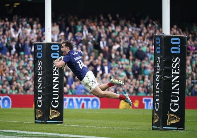 France’s Damian Penaud dives to score their side’s fifth try against Ireland