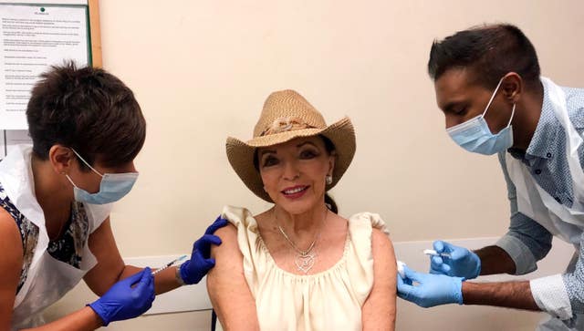 Dame Joan Collins receiving her coronavirus and flu jabs simultaneously last month