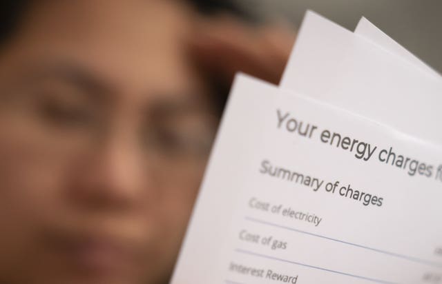 A person holding an energy bill