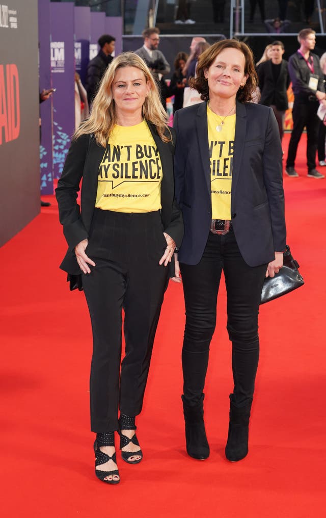 Zelda Perkins (left) and Laura Madden on the red carpet, wearing yellow 'Can't Buy My Silence' T-shirts