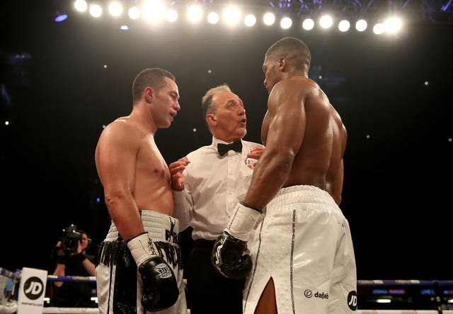 Referee Giuseppe Quartarone splits up the fighters