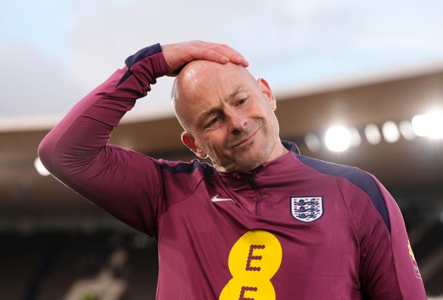 Interim England boss Lee Carsley holds his head