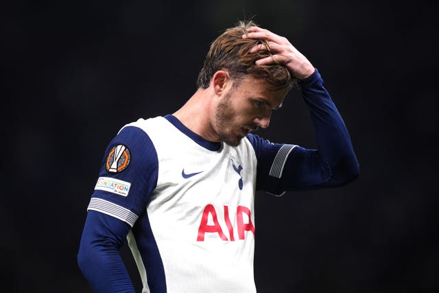 Tottenham midfielder James Maddison holds his head