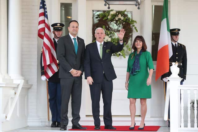 Irish Taoiseach Leo Varadkar is greeted by US vice president Mike Pence and wife Karen (Niall Carson/PA)