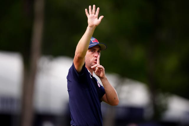 Justin Thomas appeals for supporters to quieten down at the Ryder Cup