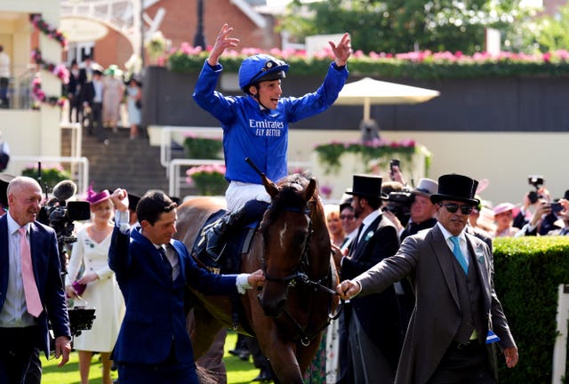 William Buick aboard Trawlerman salutes the Ascot crowd