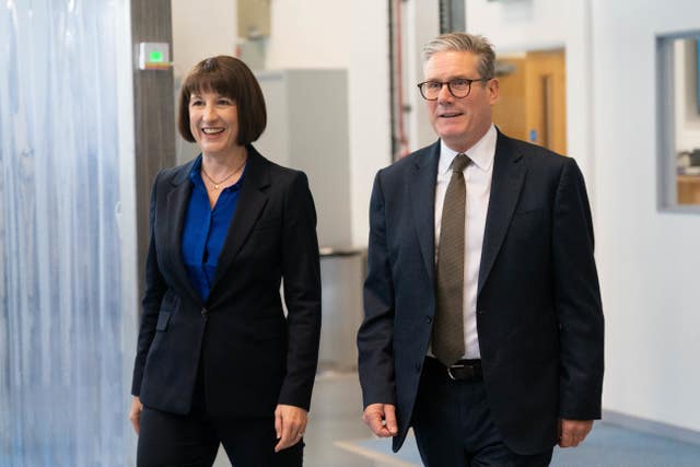 Sir Keir Starmer and Rachel Reeves walk together during a visit to Daresbury