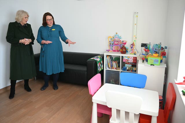 The Queen (left) is shown a paediatric non-acute room by paediatric doctor Hannah Law during a to open a new purpose-built sexual assault referral centre  in Exeter