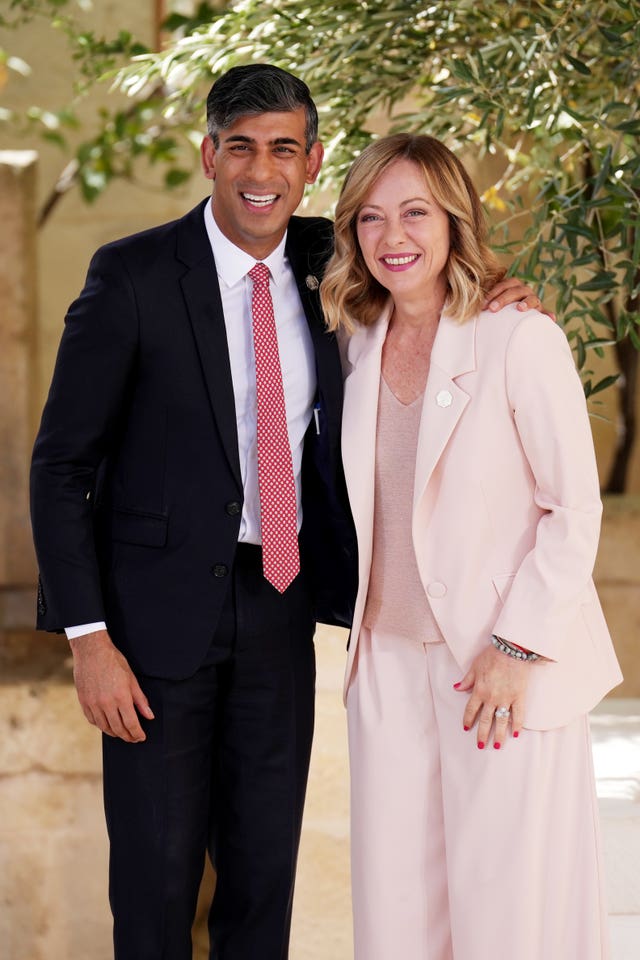 Prime Minister Rishi Sunak puts his arm around the shoulder of Italian Prime Minister Giorgia Meloni during a welcome ceremony at the G7 leaders’ summit at the Borgo Egnazia resort in Puglia