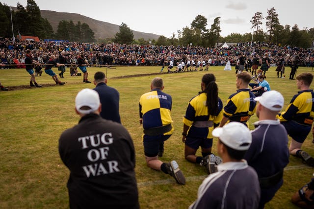 Tug of War competitors watch their opponents 