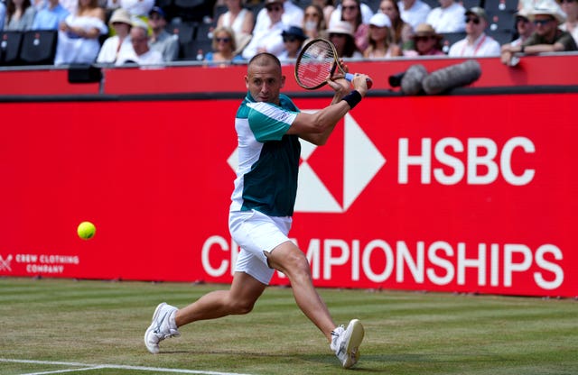 Dan Evans hits a backhand