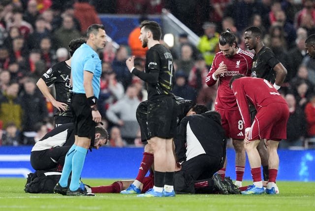 Liverpool’s Hugo Ekitike lies injured during the Champions League quarter-final match against Paris St Germain