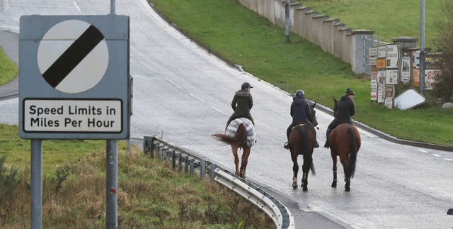 A group of horse riders crosses the border from the Republic of Ireland in to Northern Ireland (Niall Carson/PA)
