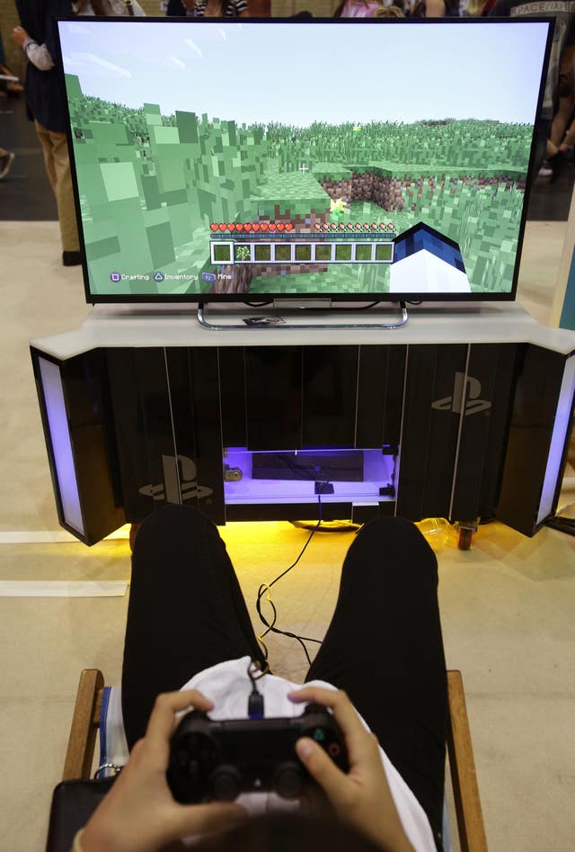 A visitor playing a game of Minecraft