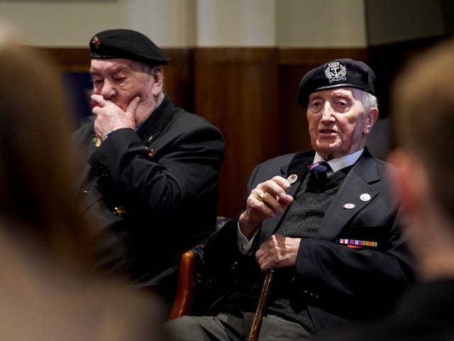 Veterans Richard Aldred (left), 99, and Stan Ford, 98, speaking to schoolchildren during a meet the veterans event 
