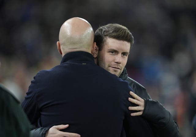 Brighton boss Fabian Hurzeler, right, and Liverpool manager Arne Slot embrace