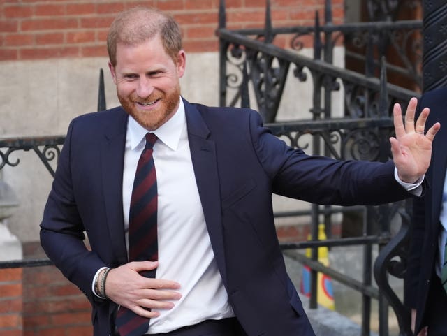 The Duke of Sussex waves as he attends a court hearing in London