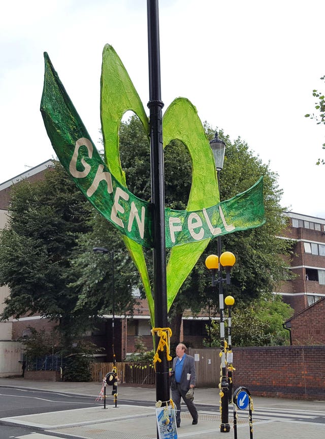 Tributes near Notting Hill Methodist Church as the opening statement during the public inquiry was made there (Peter Cary/PA)