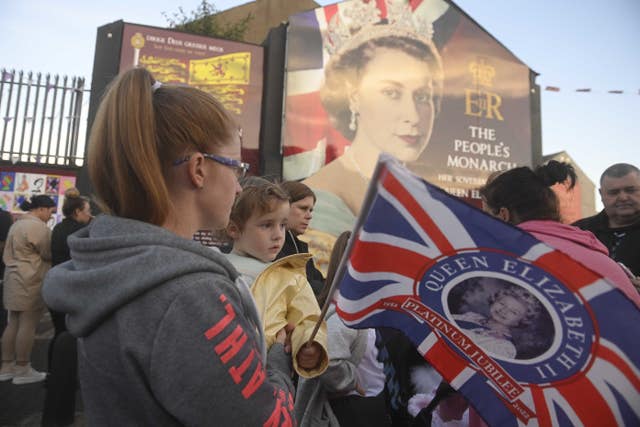 Loyalist Bands and members of the public come out to mourn the loss of Queen Elizabeth II on Belfast’s Shankill Road