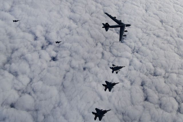 A US Air Force B-52H Stratofortress leads a formation of US F-15C Eagles, F-15E Strike Eagles and Royal Netherlands Air Force F-16s over the North Sea