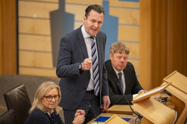 Russell Findlay standing while speaking in Holyrood
