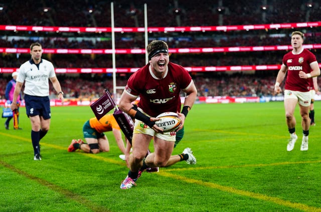 Tom Curry of the British and Irish Lions celebrates scoring a try