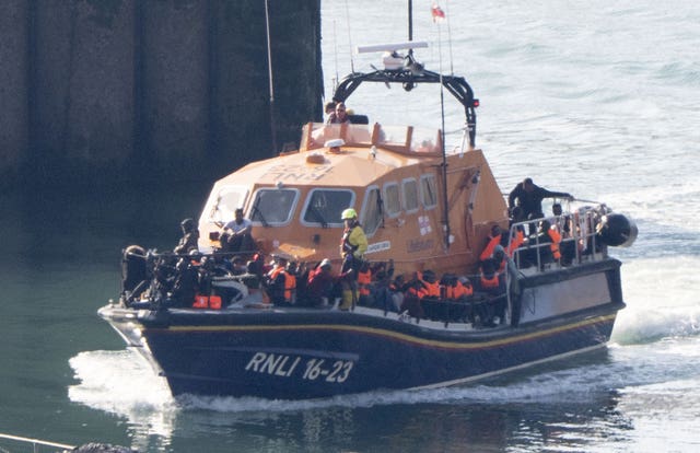 An RNLI lifeboat brings people thought to be cross-Channel migrants into Dover