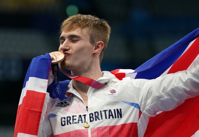 Great Britain’s Jack Laugher celebrates winning the bronze medal 