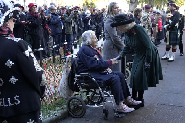 The Duchess of Cornwall meets veterans and representatives from the armed forces as she attends a service to remember the war dead on Armistice Day at the 93rd Field of Remembrance at Westminster Abbey in London, which has been held in the grounds of the abbey since November 1928