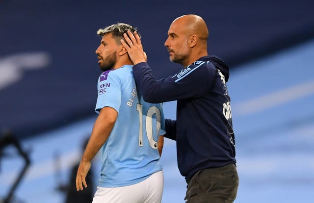 Sergio Aguero (left) and Pep Guardiola on the touchline