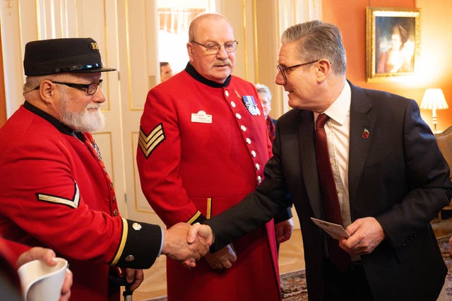 Sir Keir Starmer shaking hands with a Chelsea Pensioner