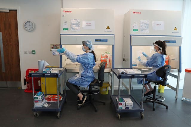 Scientists at the Lighthouse Laboratory in Glasgow which analyses coronavirus swabs taken from NHS staff and frontline workers